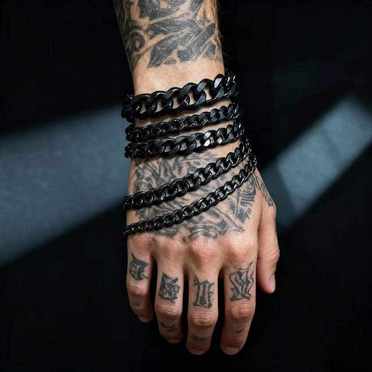 The District Cuban Bracelet in black, worn on wrist