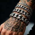 The District Cuban Bracelet in silver, stacked Cuban links on wrist