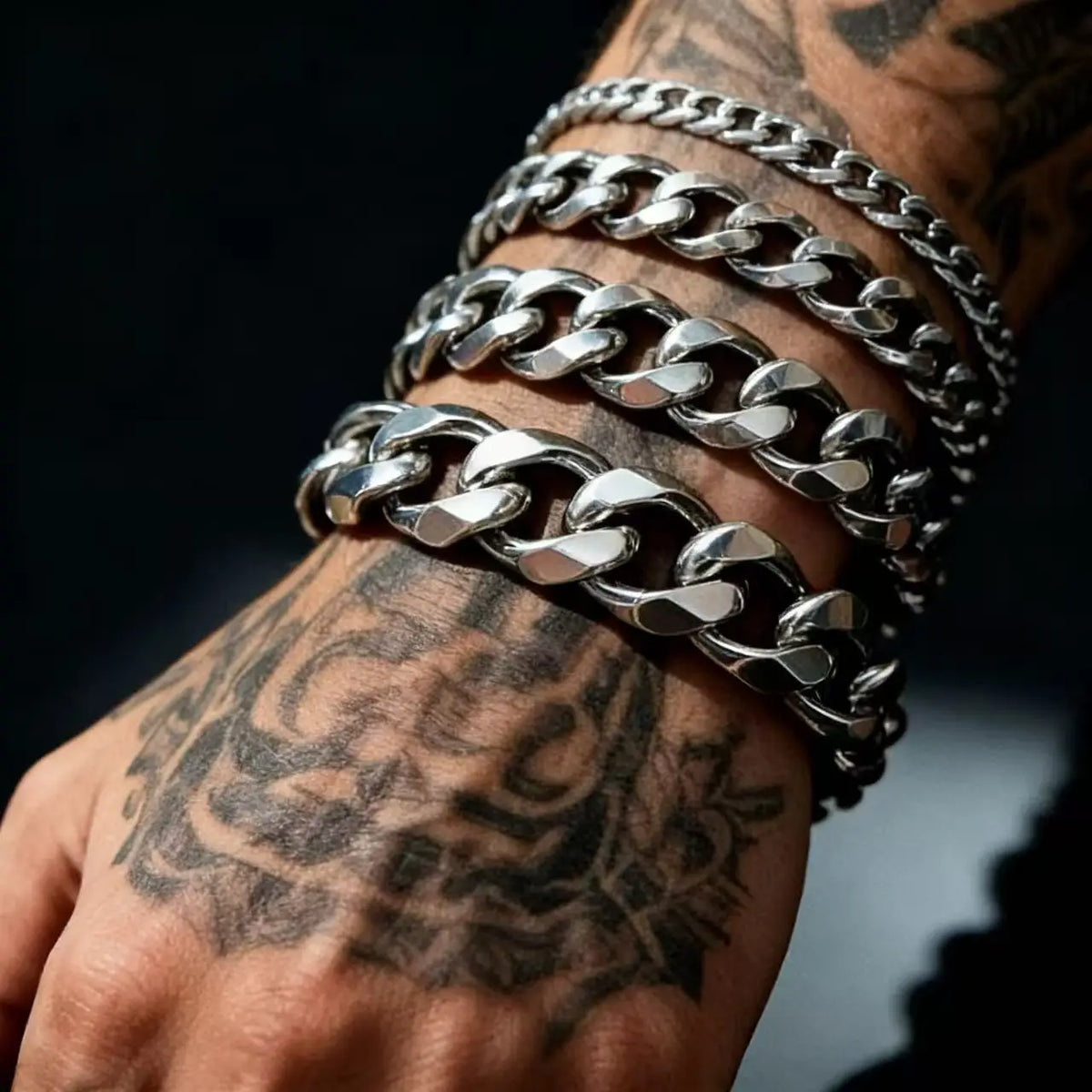 The District Cuban Bracelet in silver, stacked Cuban links on wrist
