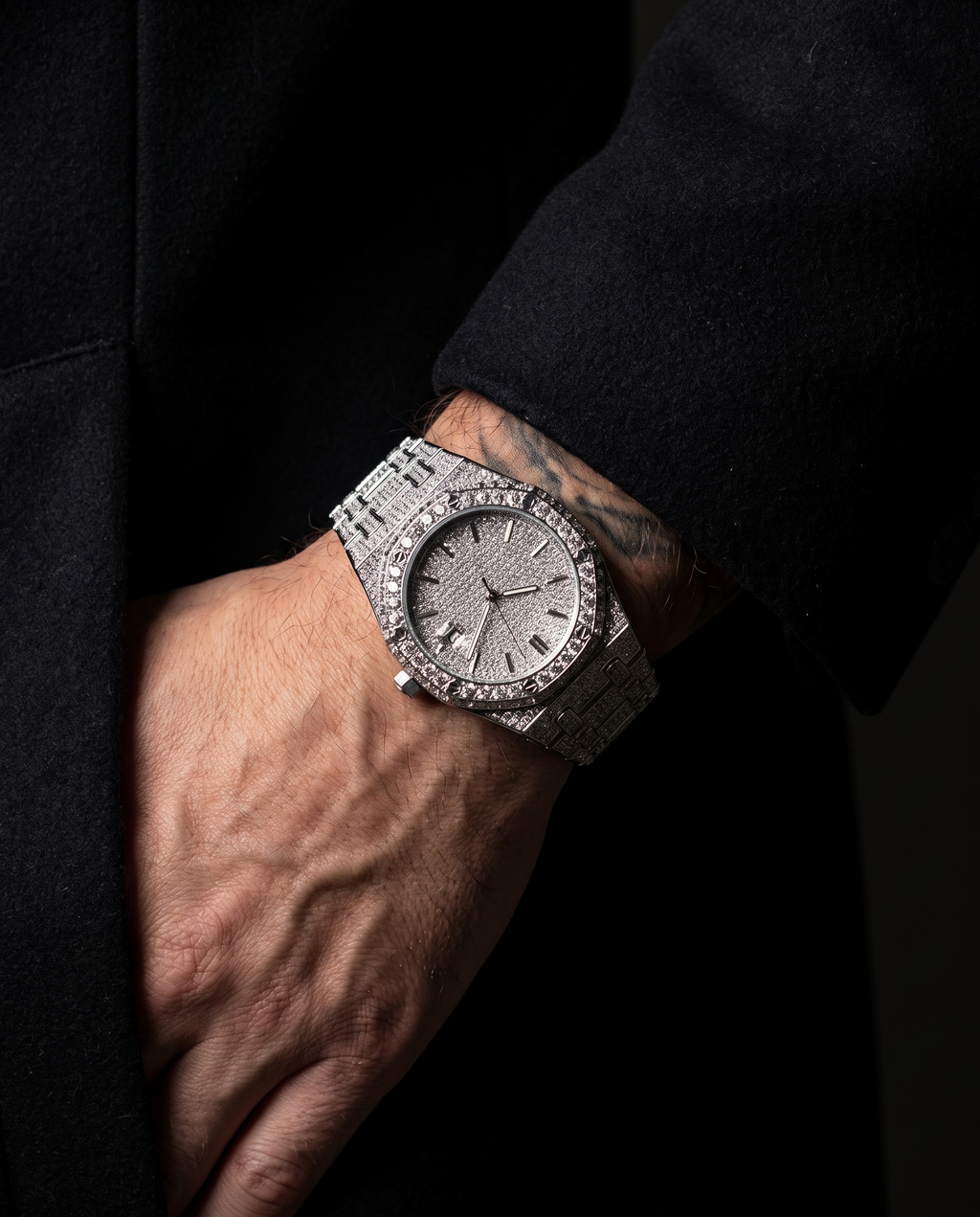 The Afterglow Watch in Silver, on-model wrist campaign image, dark editorial styling