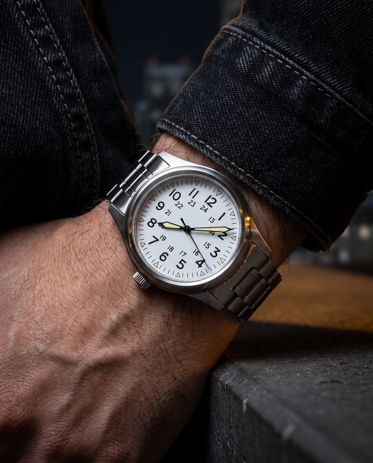 The Sentinel Watch in White, on-model wrist campaign image, night city backdrop