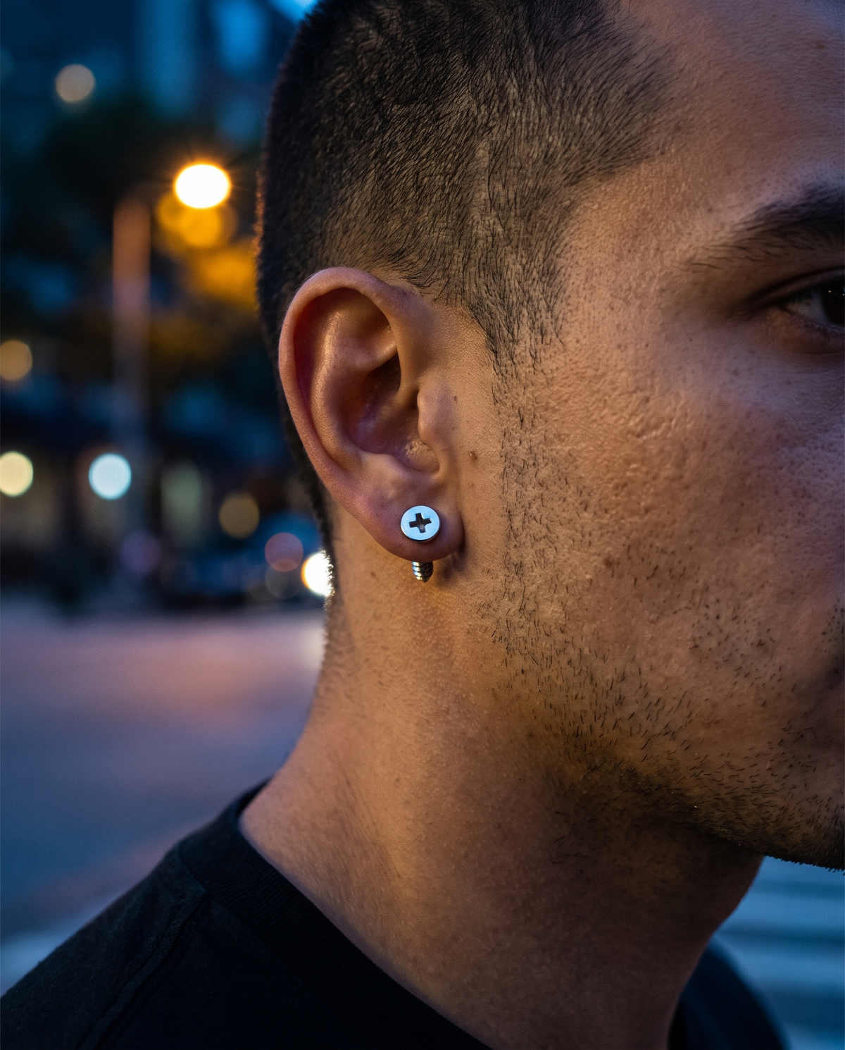 The Essentials Earring Set worn on ear, night street