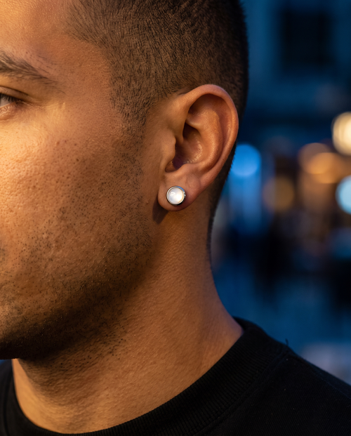 The Aurora Statement Studs worn on ear, night nightlife
