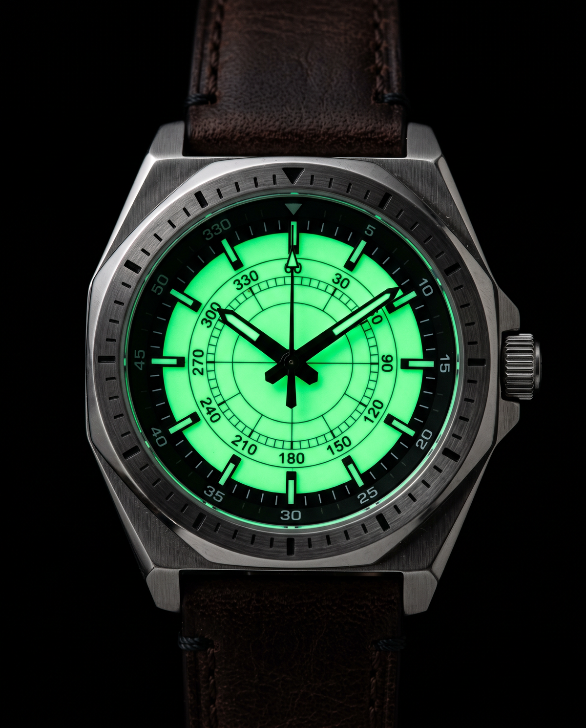 The Eclipse Watch glowing bright green in the dark